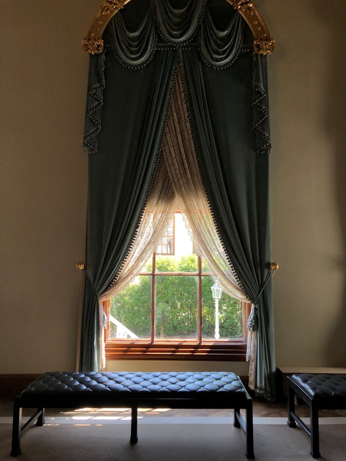 home-services-01 Classic interior design featuring ornate drapes and a sunlit window in Istanbul.